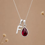Sterling silver initial F necklace with a natural January garnet