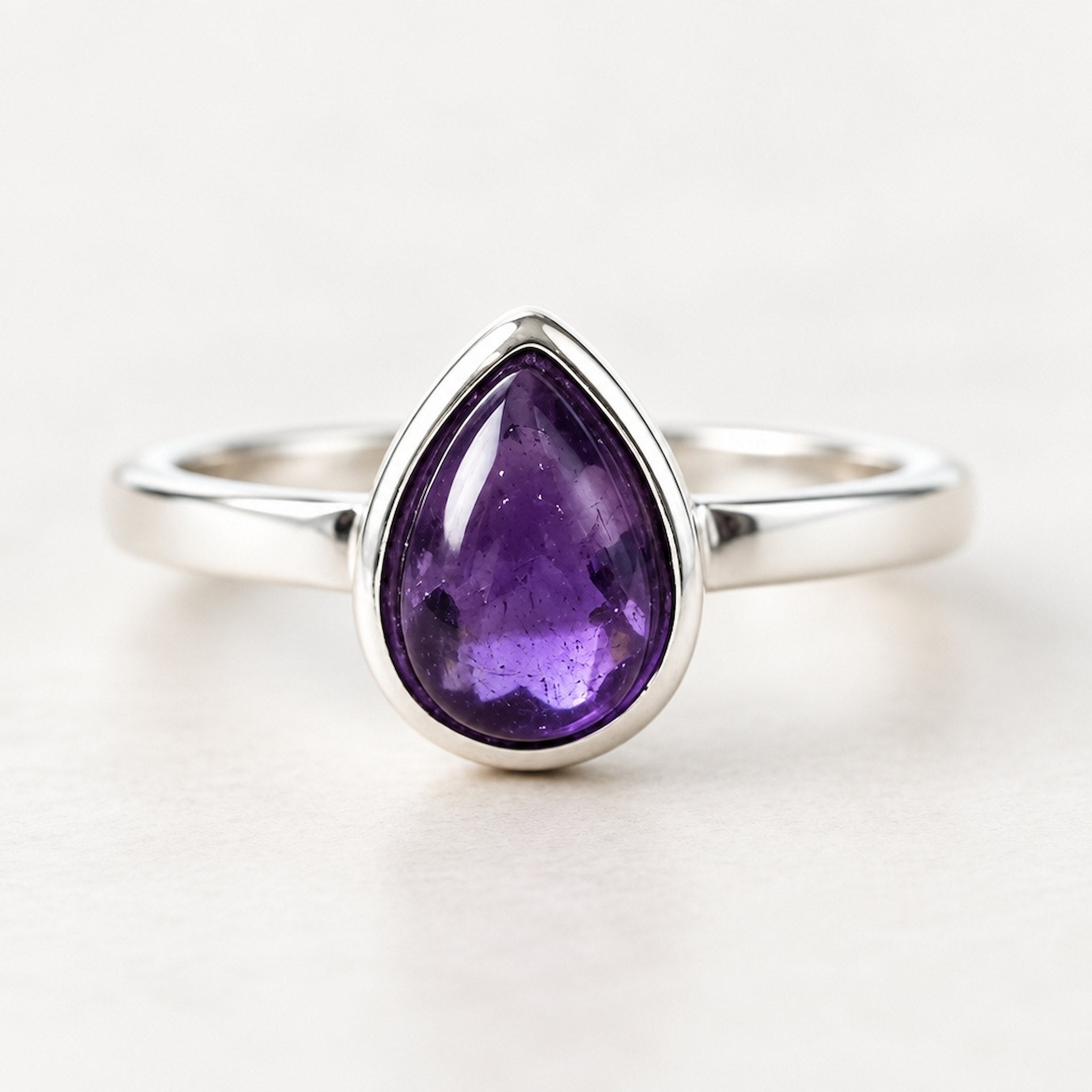 Sterling Silver February birthstone ring with pear-shaped natural amethyst gemstone as a meaningful birthstone jewellery gift for her