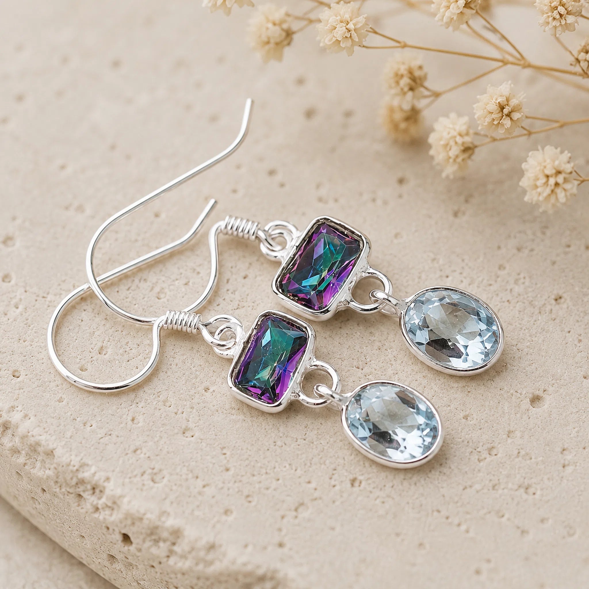 sterling silver french hook earrings with oval natural blue topaz and mystic quartz crystals