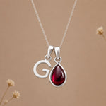 Sterling silver initial G necklace with a natural January garnet