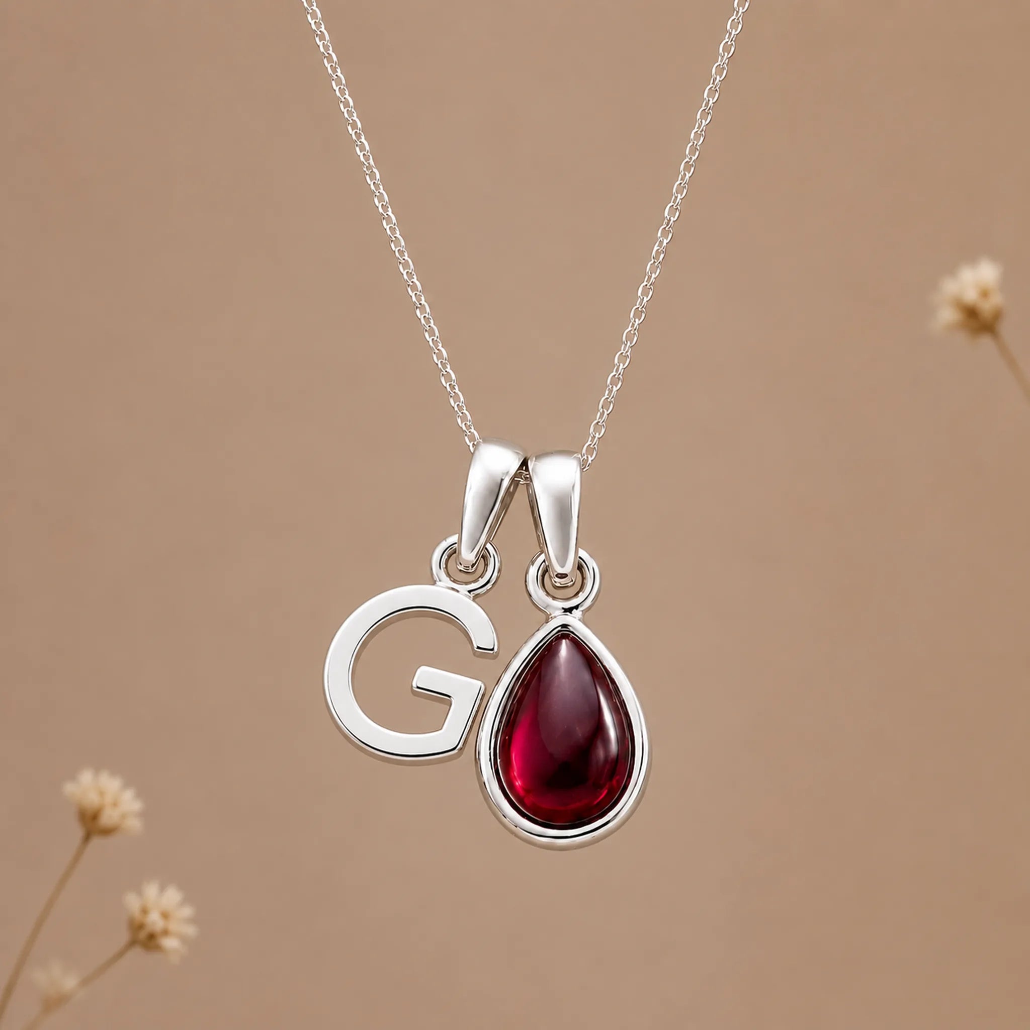 Sterling silver initial G necklace with a natural January garnet