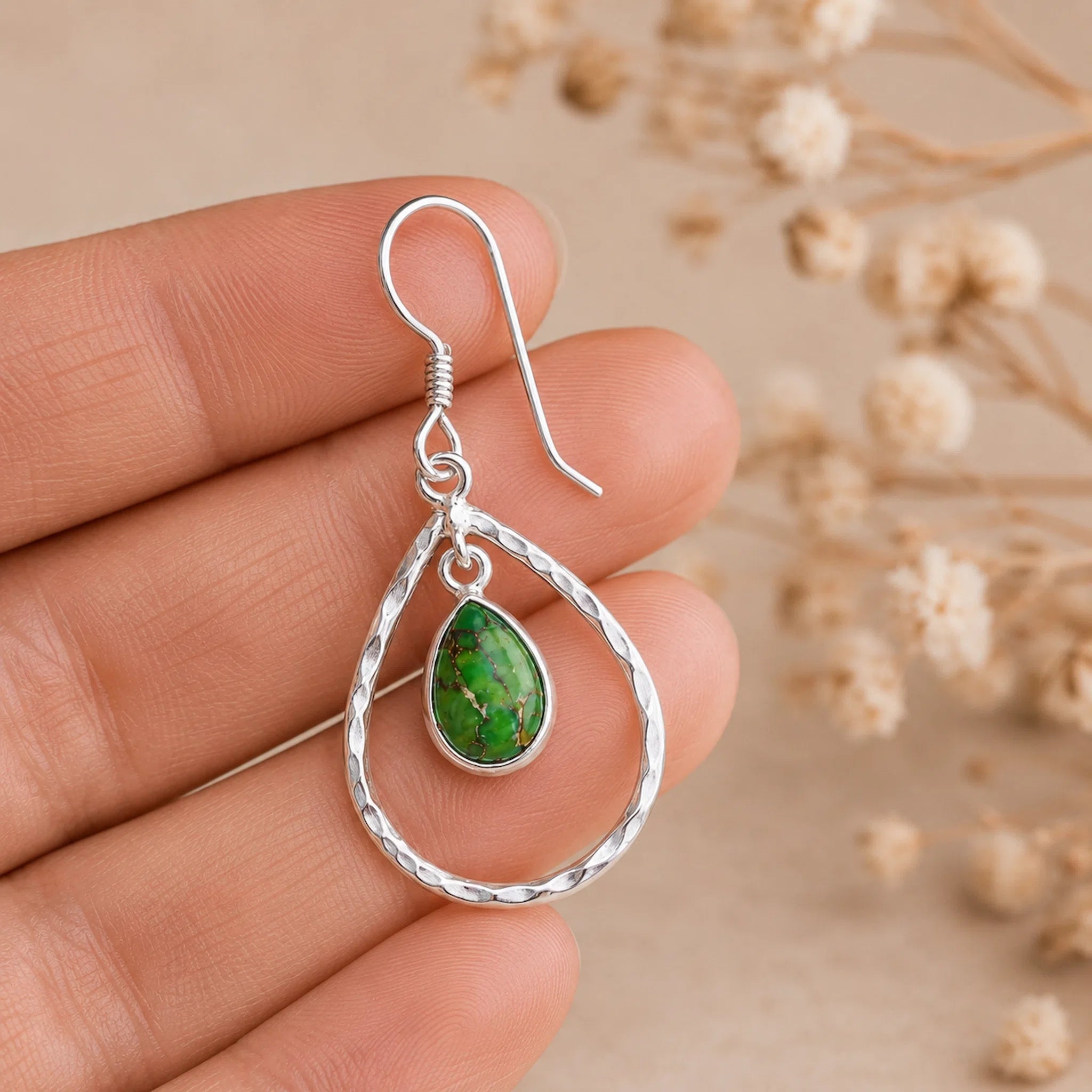 silver french hook teardrop green turquoise earring being held