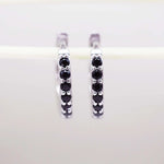 Sterling Silver dainty silver huggie earrings with black cubic zirconias