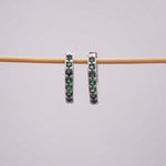Dainty huggie earrings - sterling silver and green Cubic zirconias