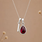 Sterling silver initial I necklace with a natural January garnet