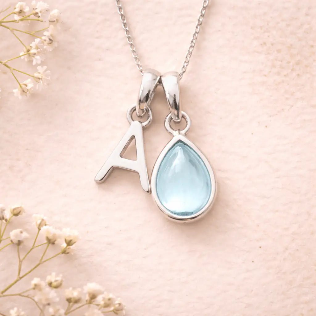 Sterling Silver March birthstone Necklace with a pear-shaped natural Aquamarine gemstone pendant and letter 'A' charm