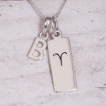 Sterling Silver necklace with a 'B' initial pendant and a Aries Zodiac pendant on a light grey background.