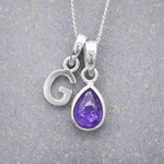 Sterling Silver February birthstone Necklace with a pear-shaped natural Amethyst gemstone pendant and letter 'G' charm