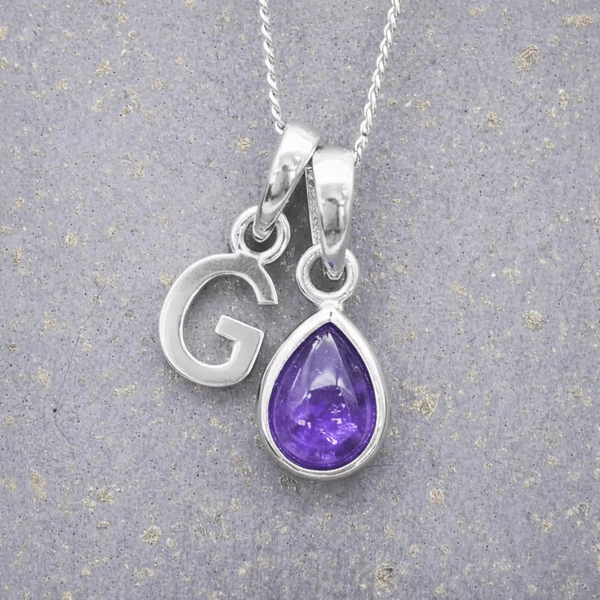 Sterling Silver February birthstone Necklace with a pear-shaped natural Amethyst gemstone pendant and letter 'G' charm