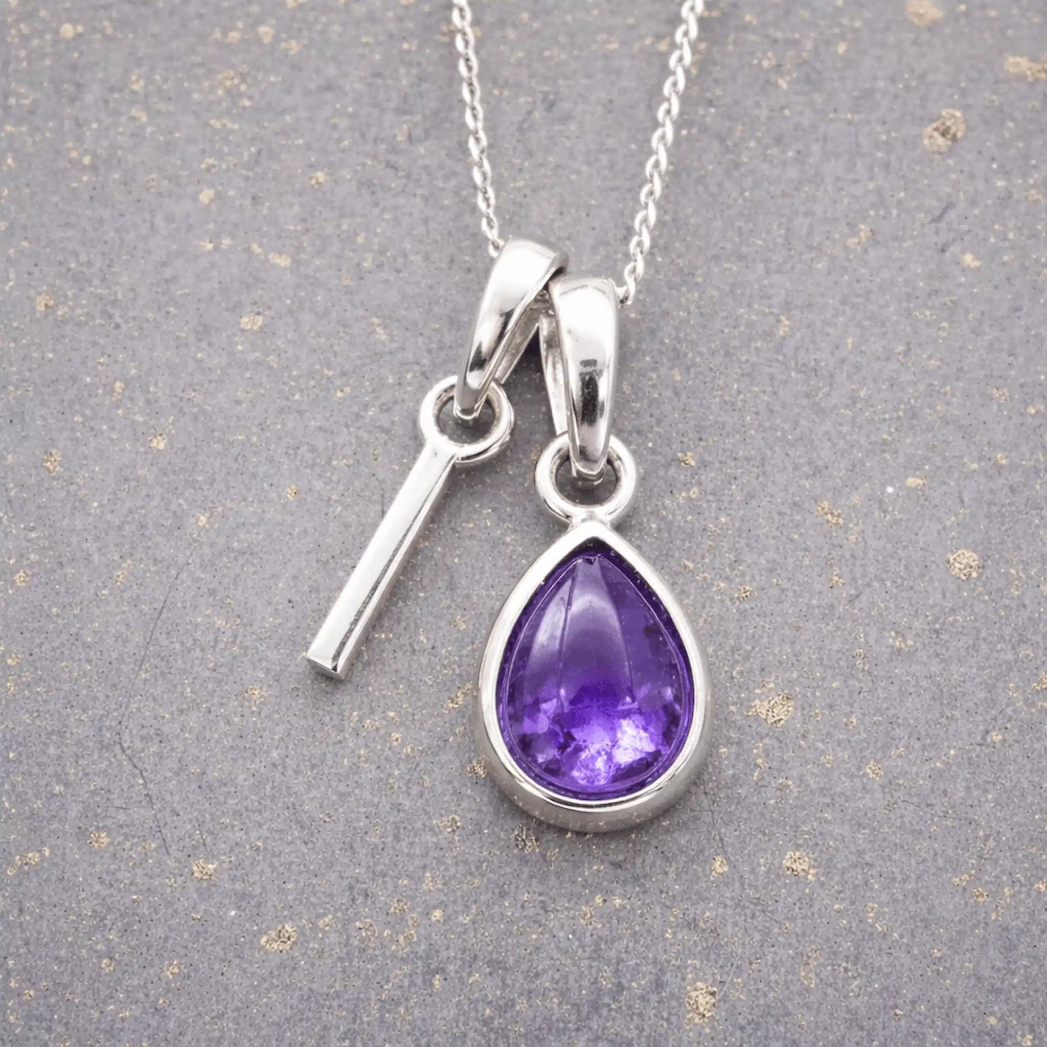 Sterling Silver February birthstone Necklace with a pear-shaped natural Amethyst gemstone pendant and letter 'I' charm