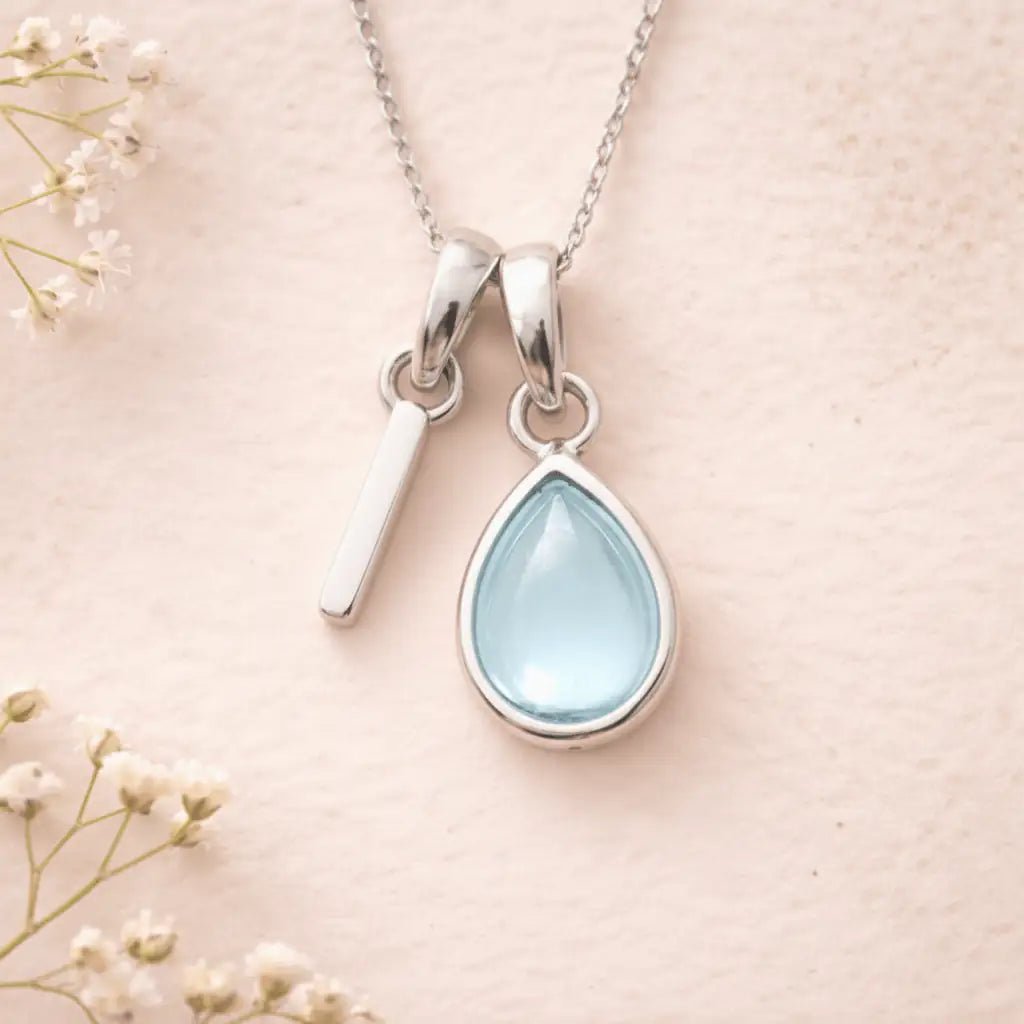 Sterling Silver March birthstone Necklace with a pear-shaped natural Aquamarine gemstone pendant and letter 'I' charm