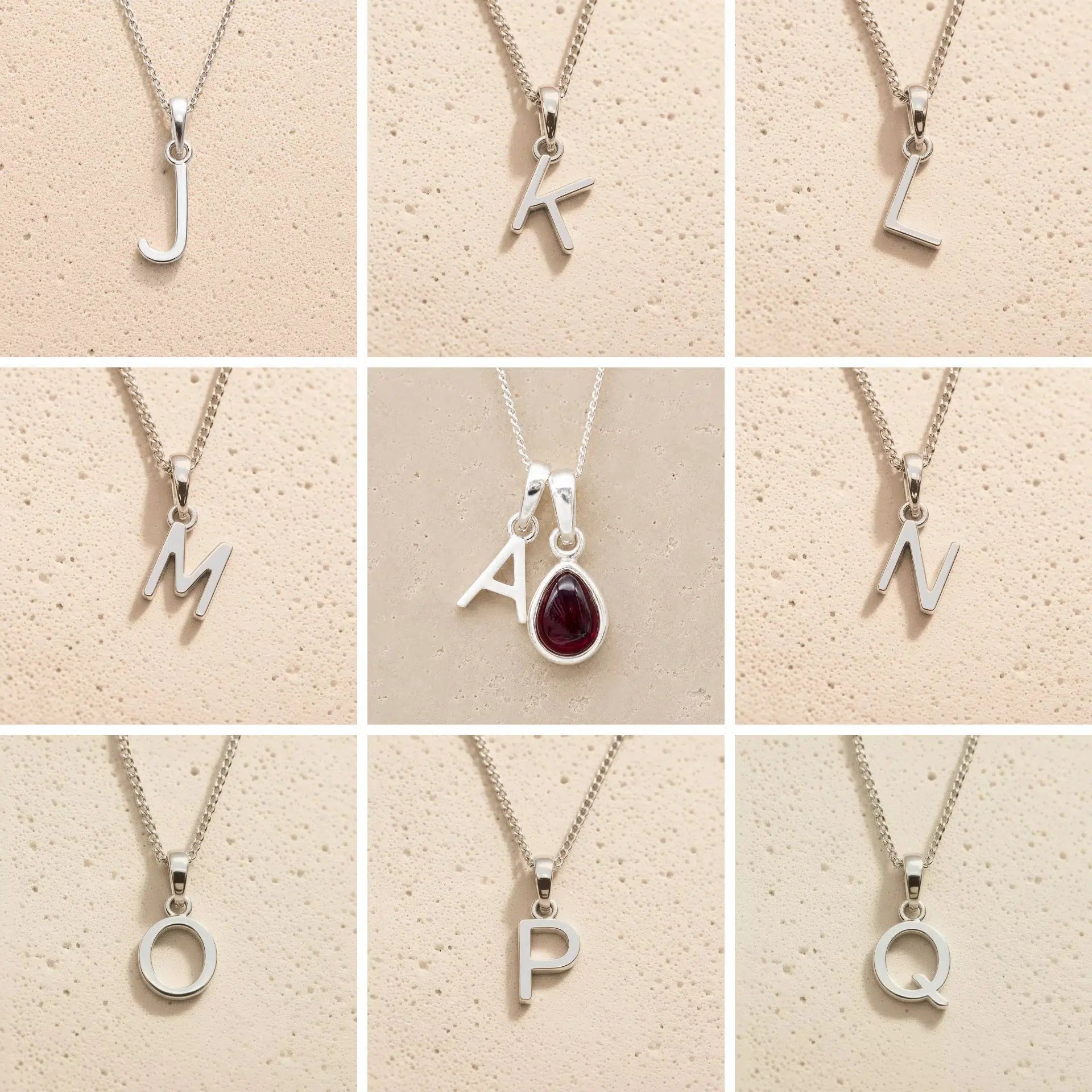 Collection of silver letter pendants a, j, k, l, m, n, o, p, q on a beige background as personalised initial options for a January Birthstone Natural Garnet Gemstone Necklace.