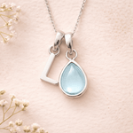 Sterling Silver March birthstone Necklace with a pear-shaped natural Aquamarine gemstone pendant and letter 'L' charm