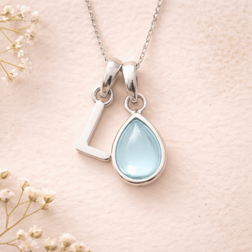 Sterling Silver March birthstone Necklace with a pear-shaped natural Aquamarine gemstone pendant and letter 'L' charm