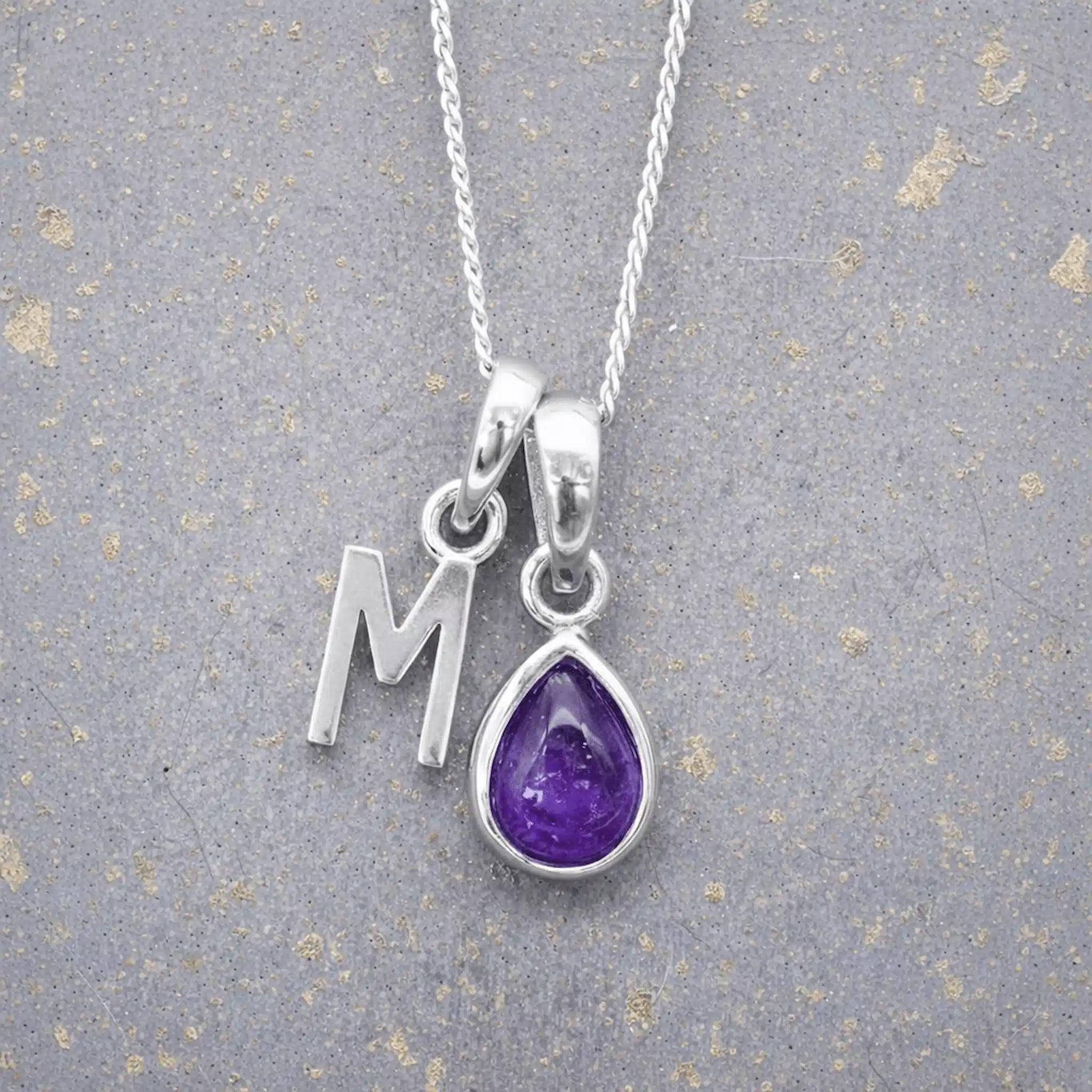 Sterling Silver February birthstone Necklace with a pear-shaped natural Amethyst gemstone pendant and letter 'M' charm