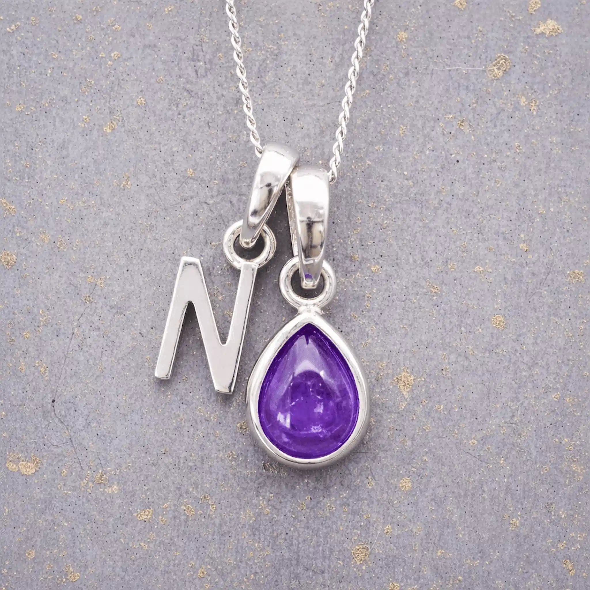 Sterling Silver February birthstone Necklace with a pear-shaped natural Amethyst gemstone pendant and letter 'N' charm