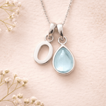 Sterling Silver March birthstone Necklace with a pear-shaped natural Aquamarine gemstone pendant and letter 'O' charm