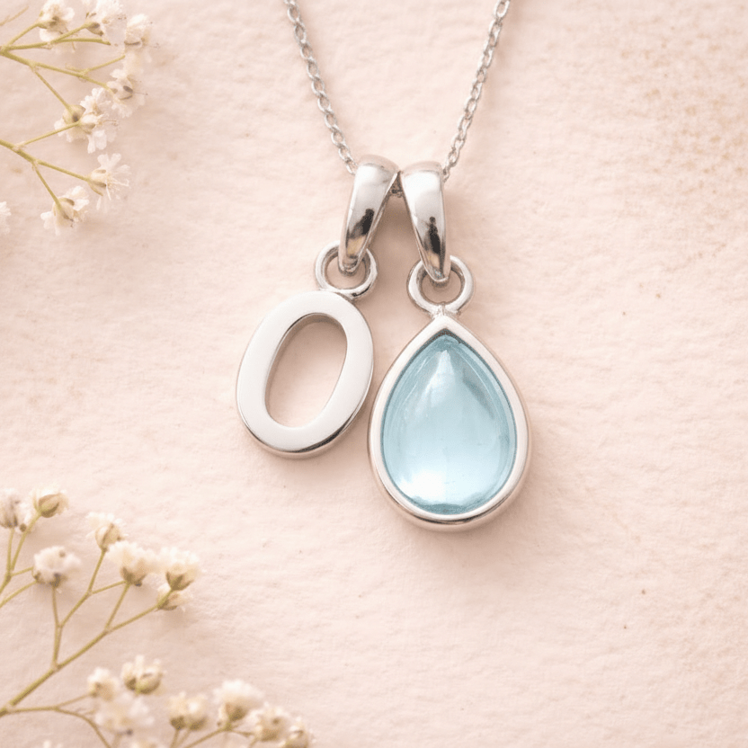 Sterling Silver March birthstone Necklace with a pear-shaped natural Aquamarine gemstone pendant and letter 'O' charm