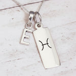 Sterling Silver Double pendant necklace with a letter E pendant and a rectangle pendant with the pisces zodiac glyph.