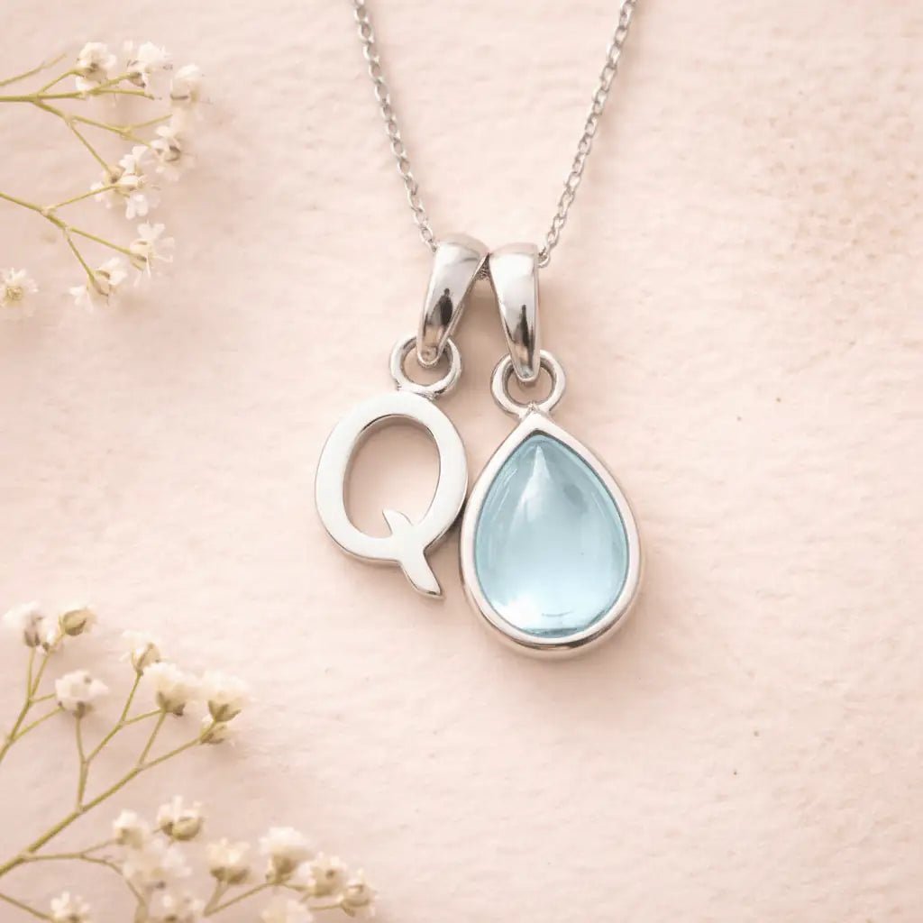 Sterling Silver March birthstone Necklace with a pear-shaped natural Aquamarine gemstone pendant and letter 'Q' charm