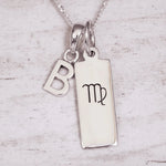 Silver ‘b’ initial pendant necklace with a pendant featuring a Virgo zodiac symbol on a light background