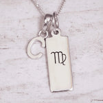 Silver ‘C’ initial pendant necklace with a pendant featuring a Virgo zodiac symbol on a light background