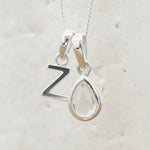 Sterling Silver April Birthstone Necklace with a personalised Z Initial Pendant and Clear Quartz Pendant.