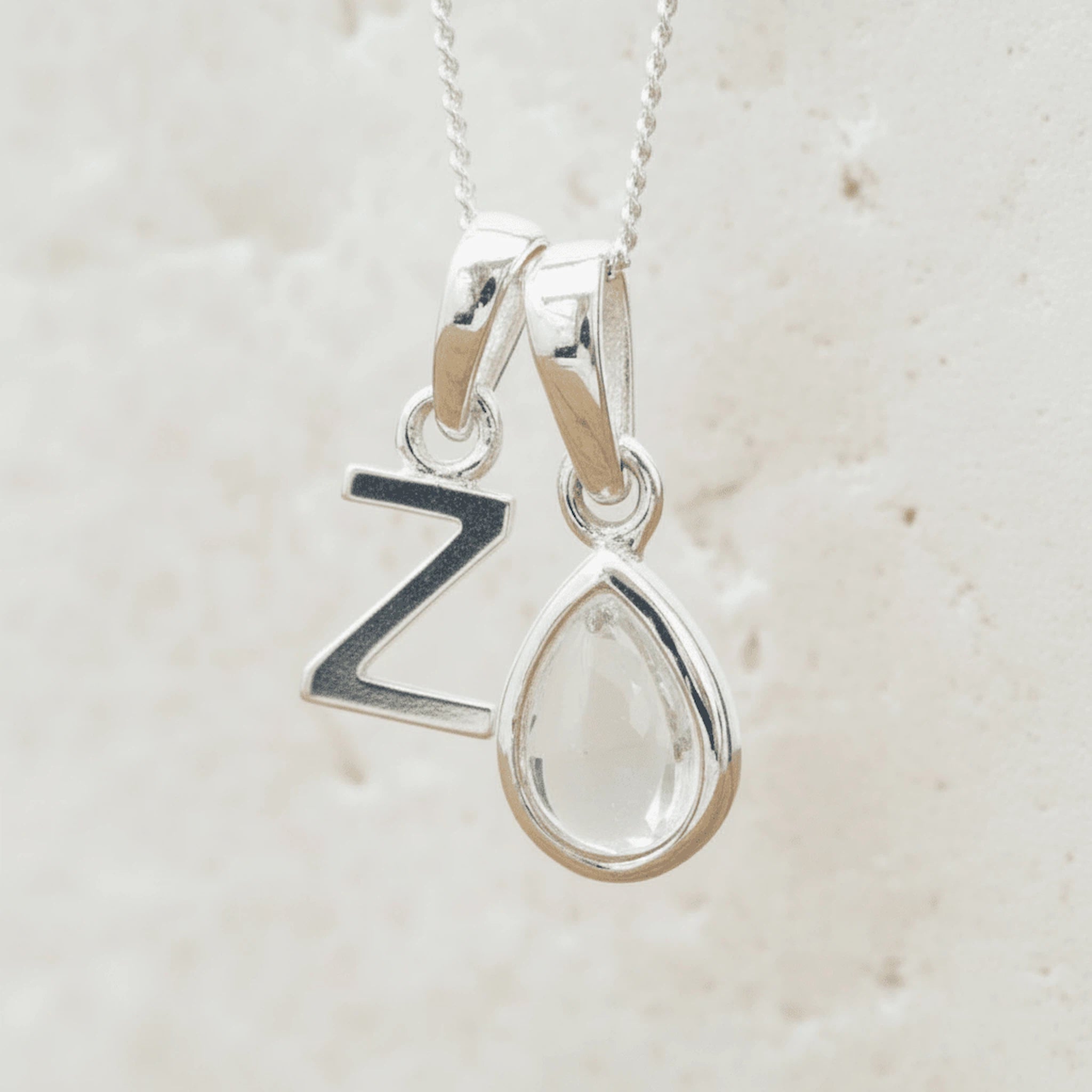 Sterling Silver April Birthstone Necklace with a personalised Z Initial Pendant and Clear Quartz Pendant.