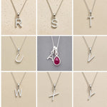 Collection of silver letter pendants R to Y on beige and grey backgrounds as personalised initial pendant options for July Birthstone Ruby Necklace.