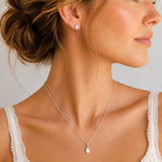 Sterling Silver June Birthstone Jewellery worn on a model, featuring a teardrop pendant pearl necklace and matching stud pearl earrings with natural milky white teardrop pearls