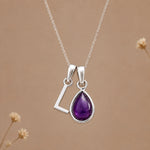 Sterling silver initial L necklace with a February amethyst pendant