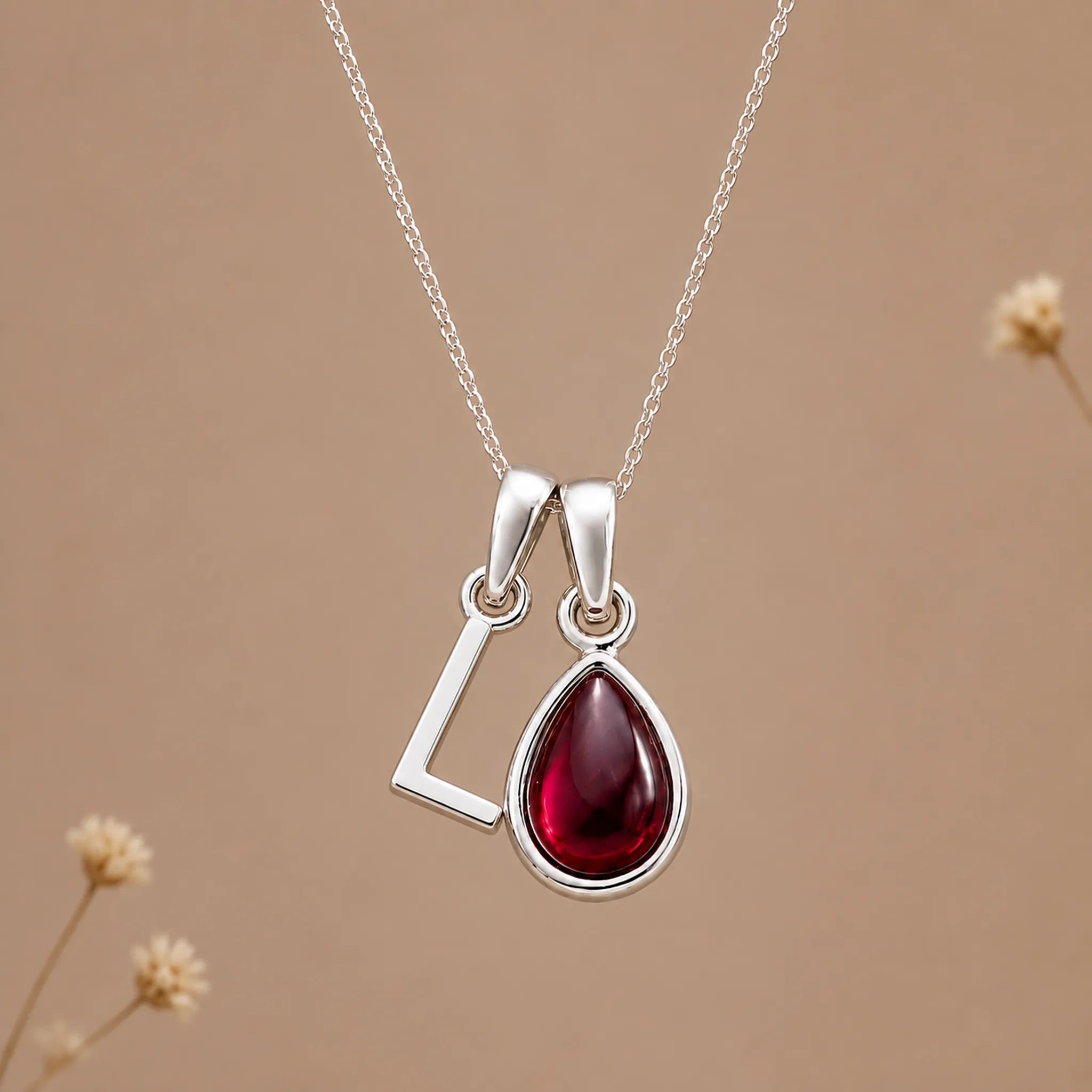 Sterling silver initial L necklace with a natural January garnet