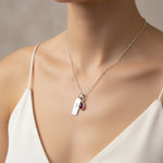 Sterling silver Leo Zodiac necklace with a July birthstone natural ruby gemstone pendant being worn