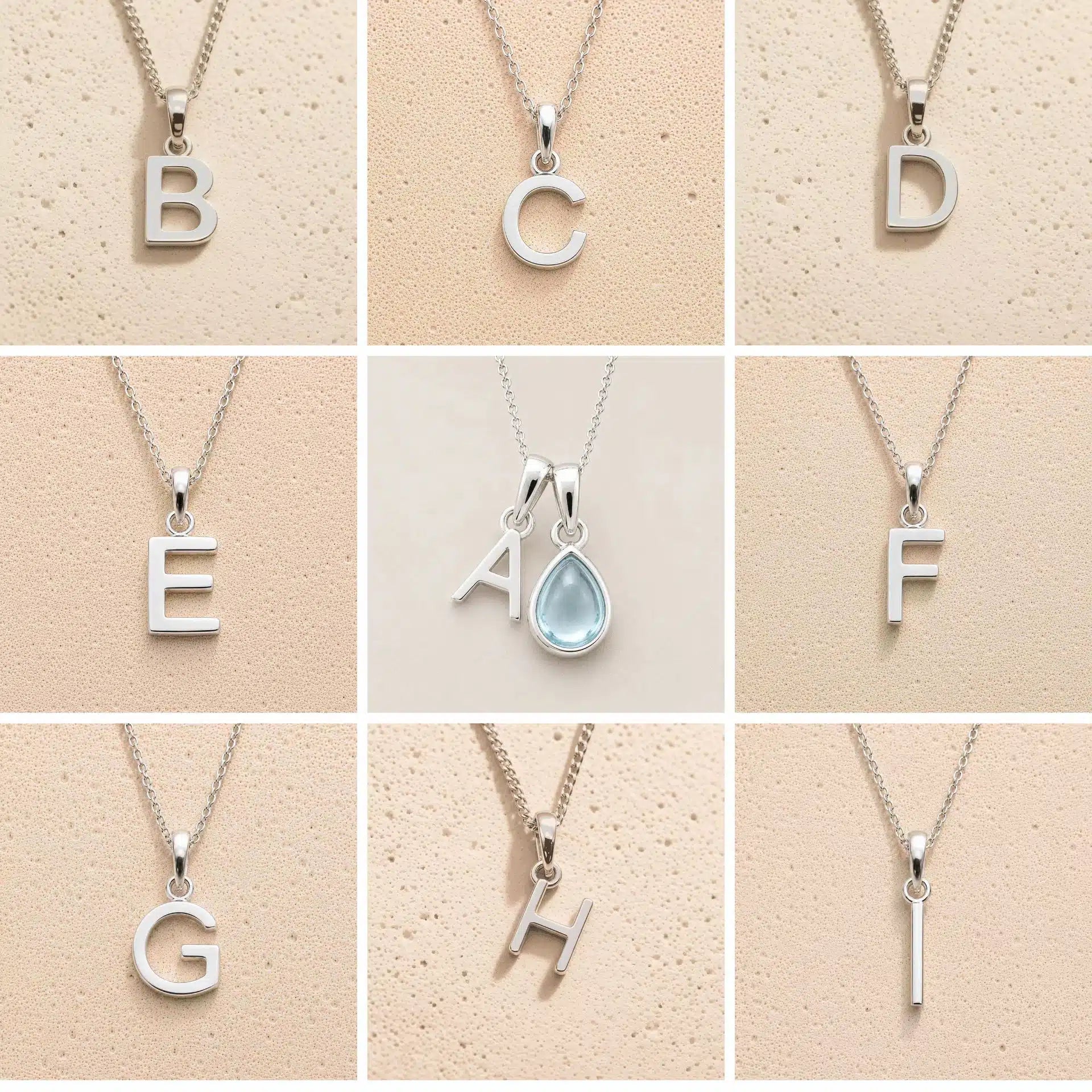 Collection of silver necklaces with letter pendants B to I on a beige background, as personalised initial options for a March Birthstone Aquamarine Necklace.