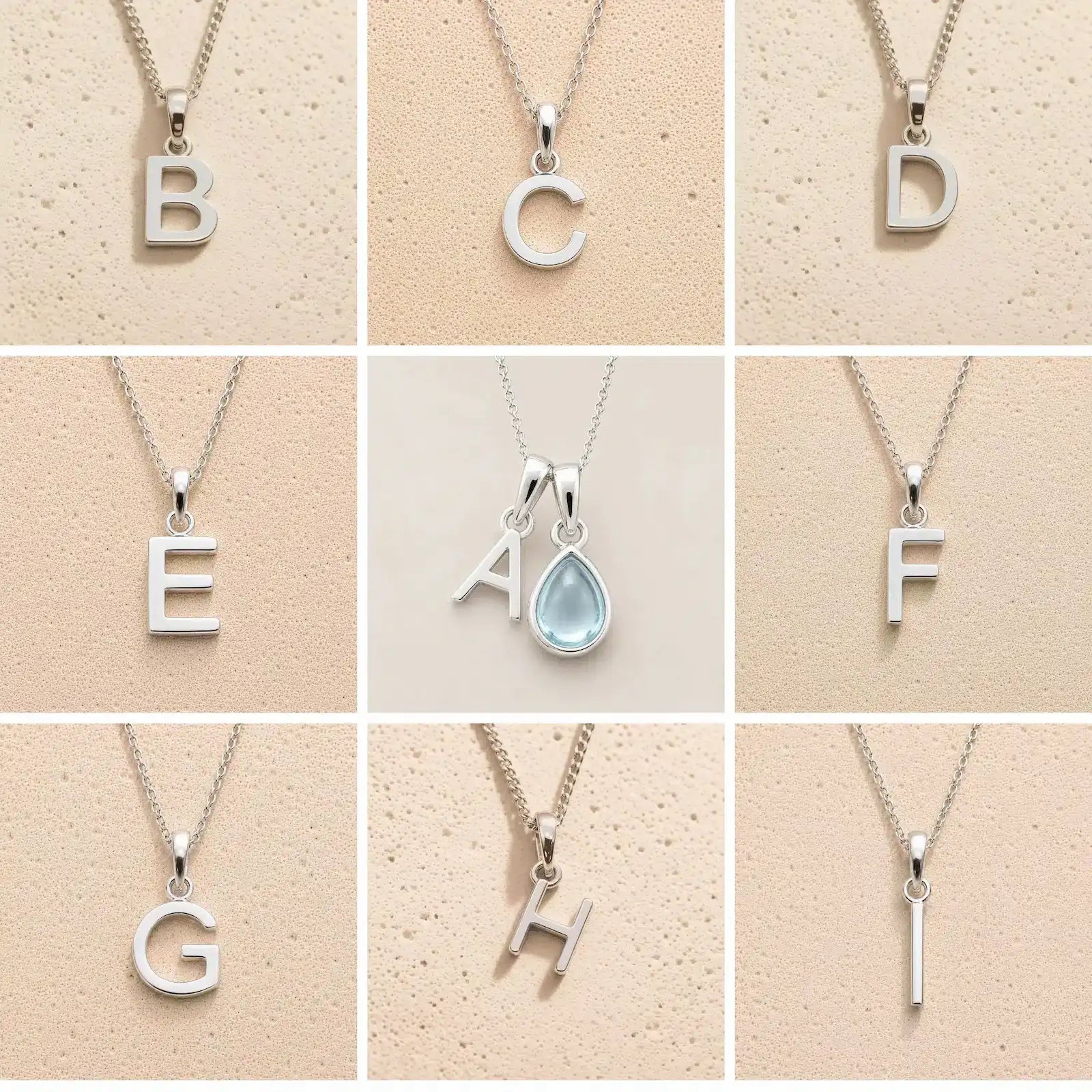 Collection of silver necklaces with letter pendants B to I on a beige background, as personalised initial options for a March Birthstone Aquamarine Necklace.