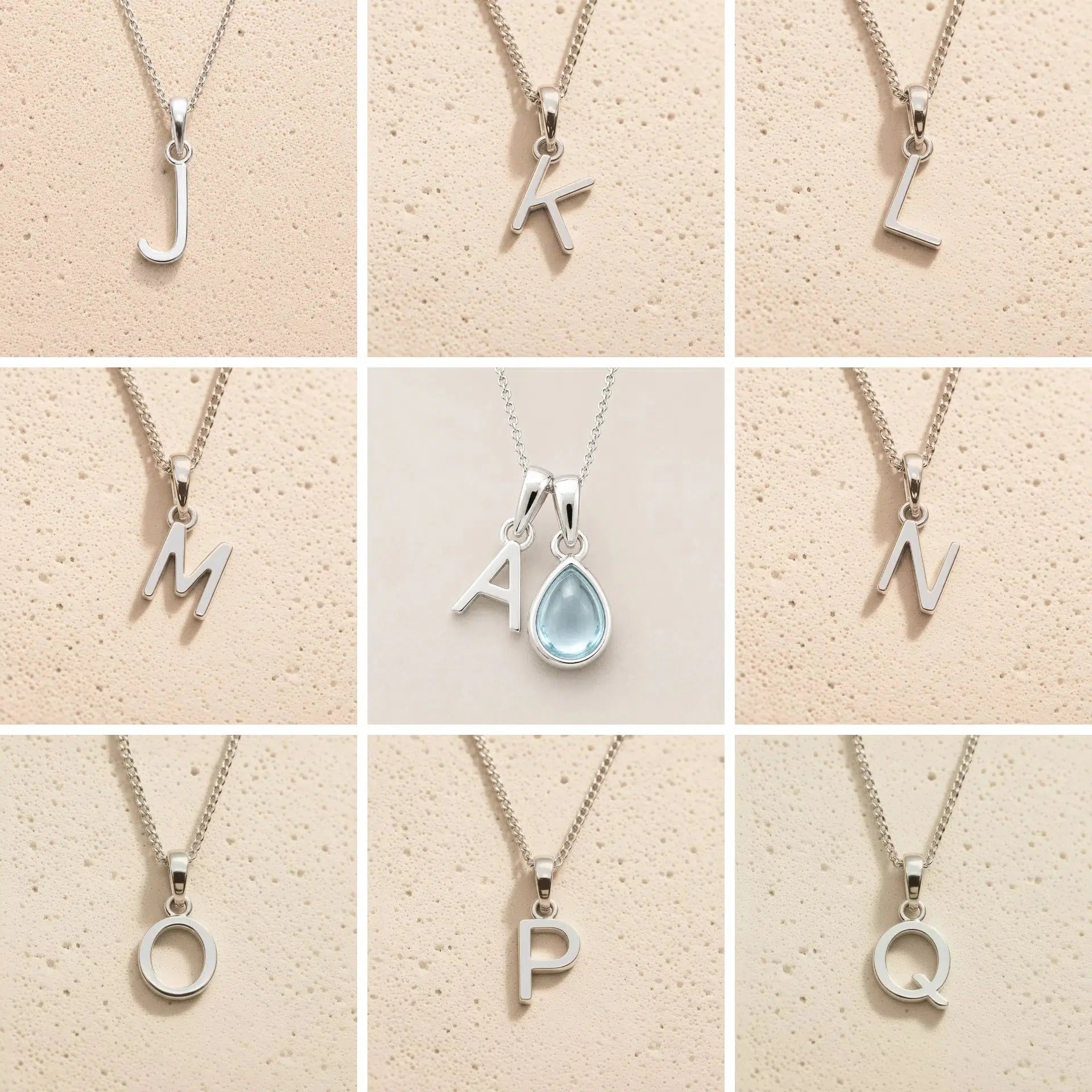 Collection of silver necklaces with letter pendants J to Q on a beige background, as personalised initial options for a March Birthstone Aquamarine Necklace.
