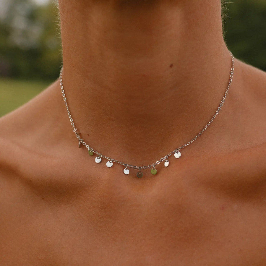 woman wearing sterling silver choker necklace with mini disc detailing