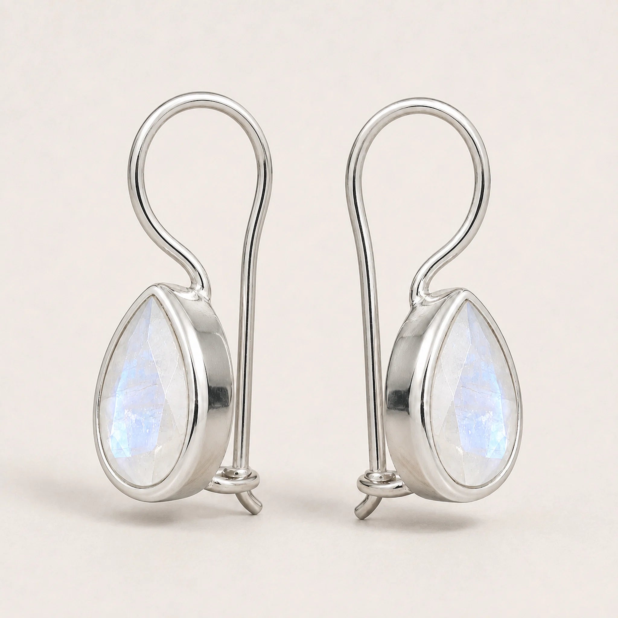 sterling silver moonstone earrings featuring faceted bezel-set pear-shaped natural moonstones