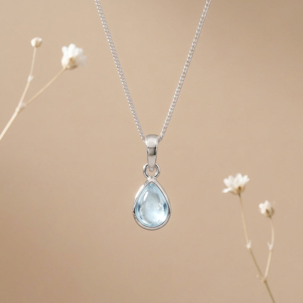 Sterling silver November birthstone blue topaz necklace with a pear-shaped pendant