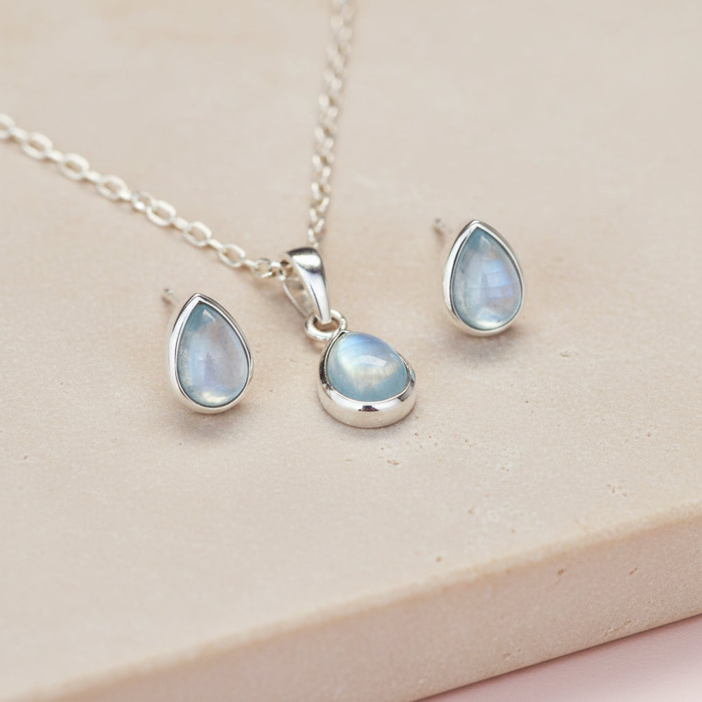 Sterling Silver Jewellery Set with tear drop shaped topaz stud earrings and dainty necklace with a tear drop shaped topaz 
