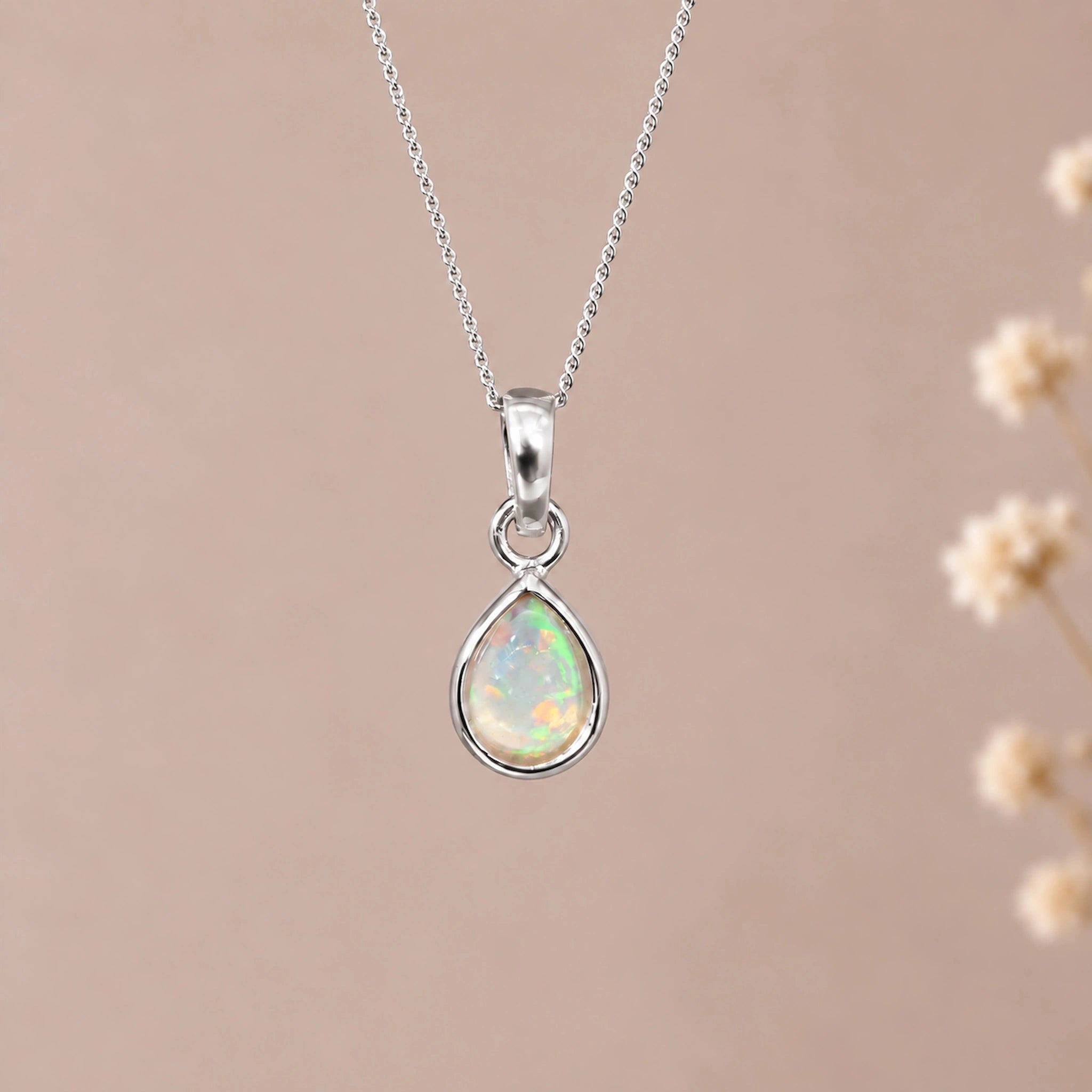 Silver October birthstone necklace with a teardrop natural opal pendant