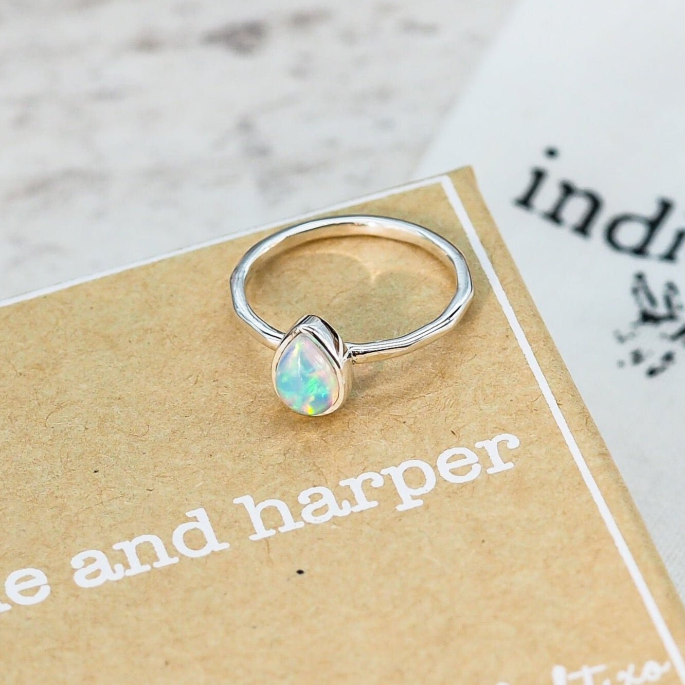 Sterling Silver October birthstone ring with a pear-shaped opal stone as a meaningful birthstone jewellery gift for her.