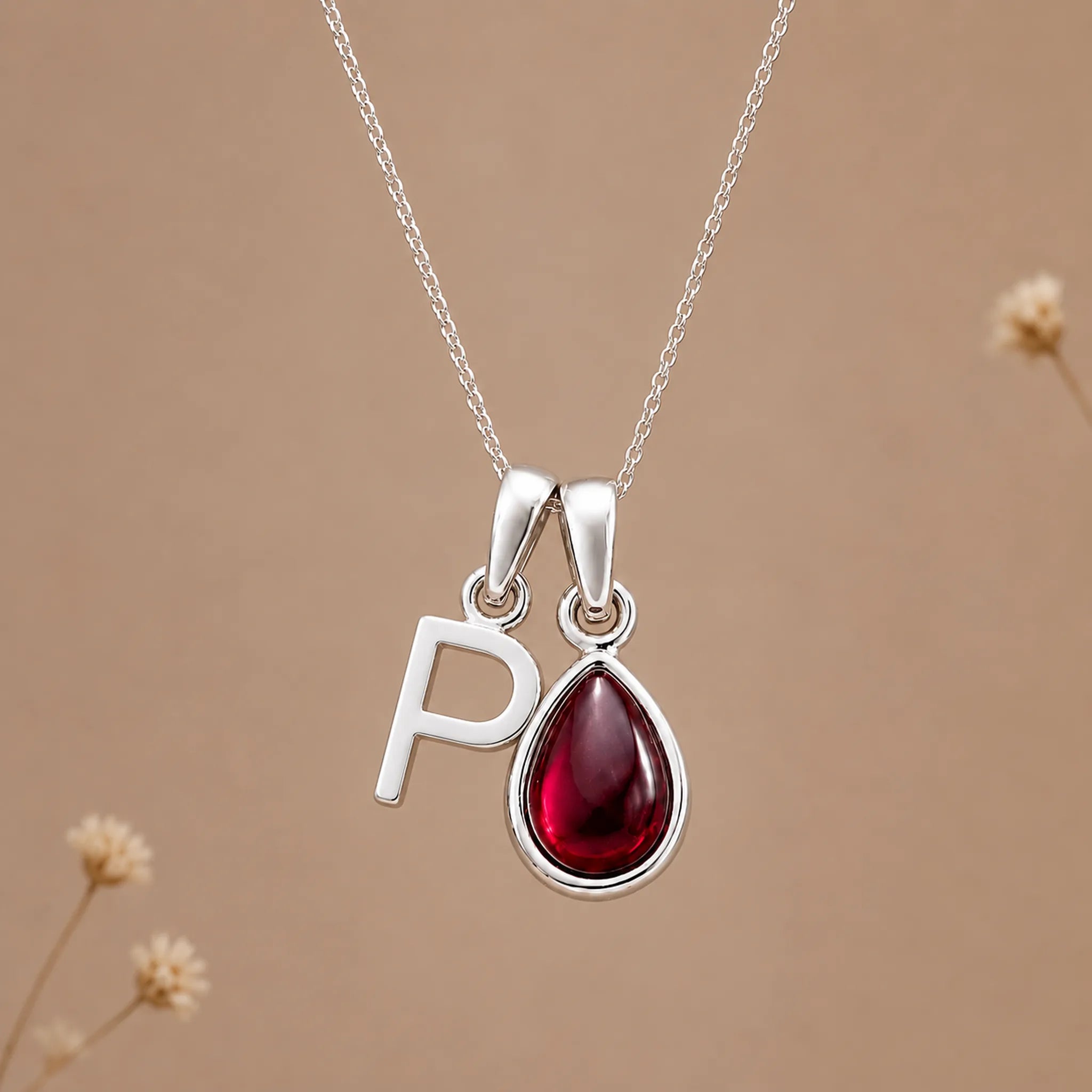 Sterling silver initial P necklace with a natural January garnet