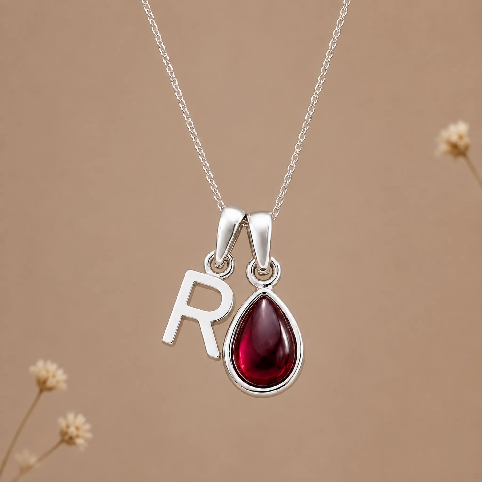 Sterling silver initial R necklace with a natural January garnet