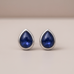 sterling silver september birthstone earrings with pear-shaped sapphire gemstones as a meaningful birthday gift for her