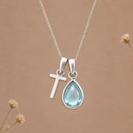 Sterling silver T initial necklace with pale blue March aquamarine in a polished teardrop bezel