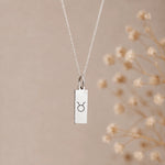 sterling silver taurus necklace with rectangle pendant engraved with taurus zodiac star sign line glyph