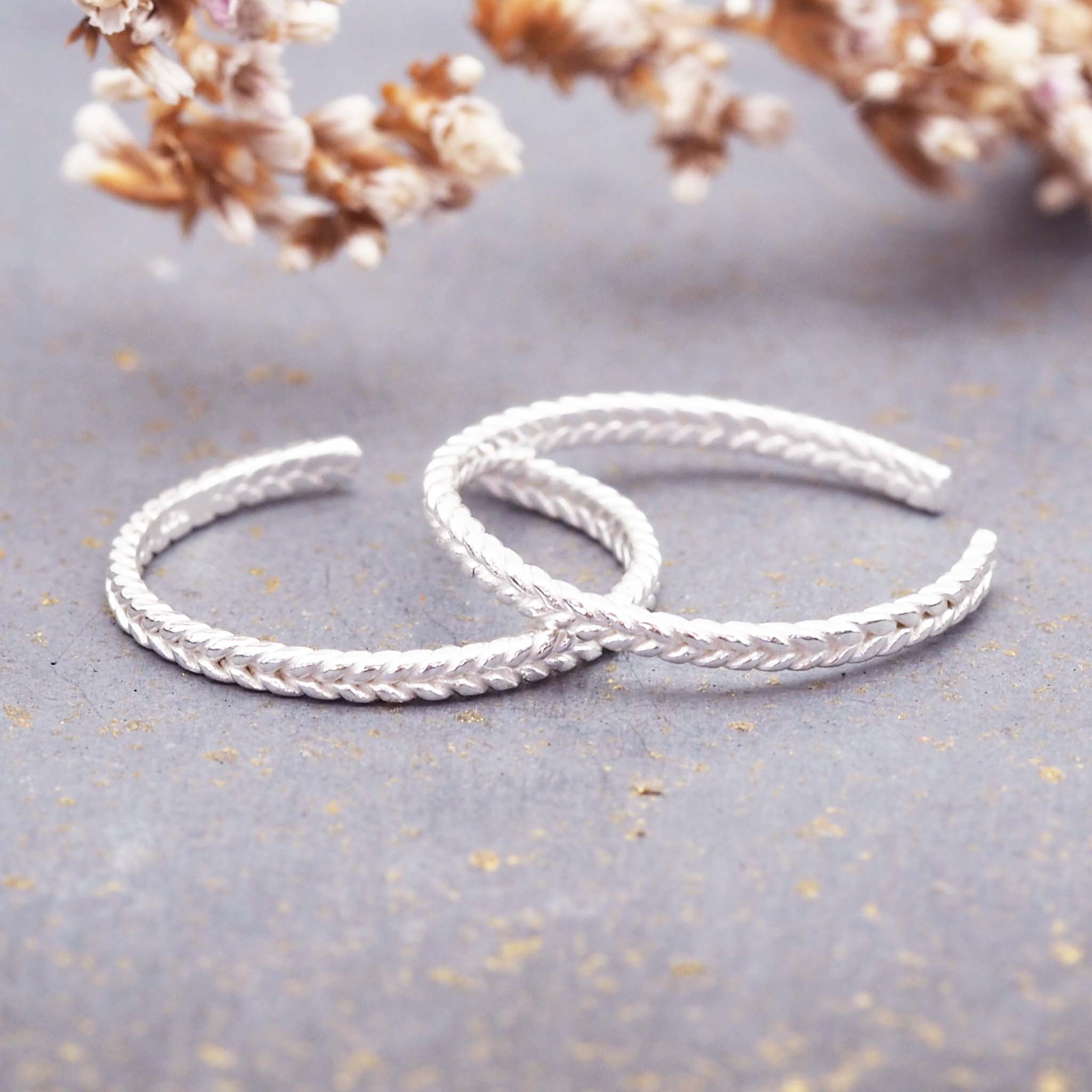 dainty sterling silver toe ring with braided detailing and semi adjustable design