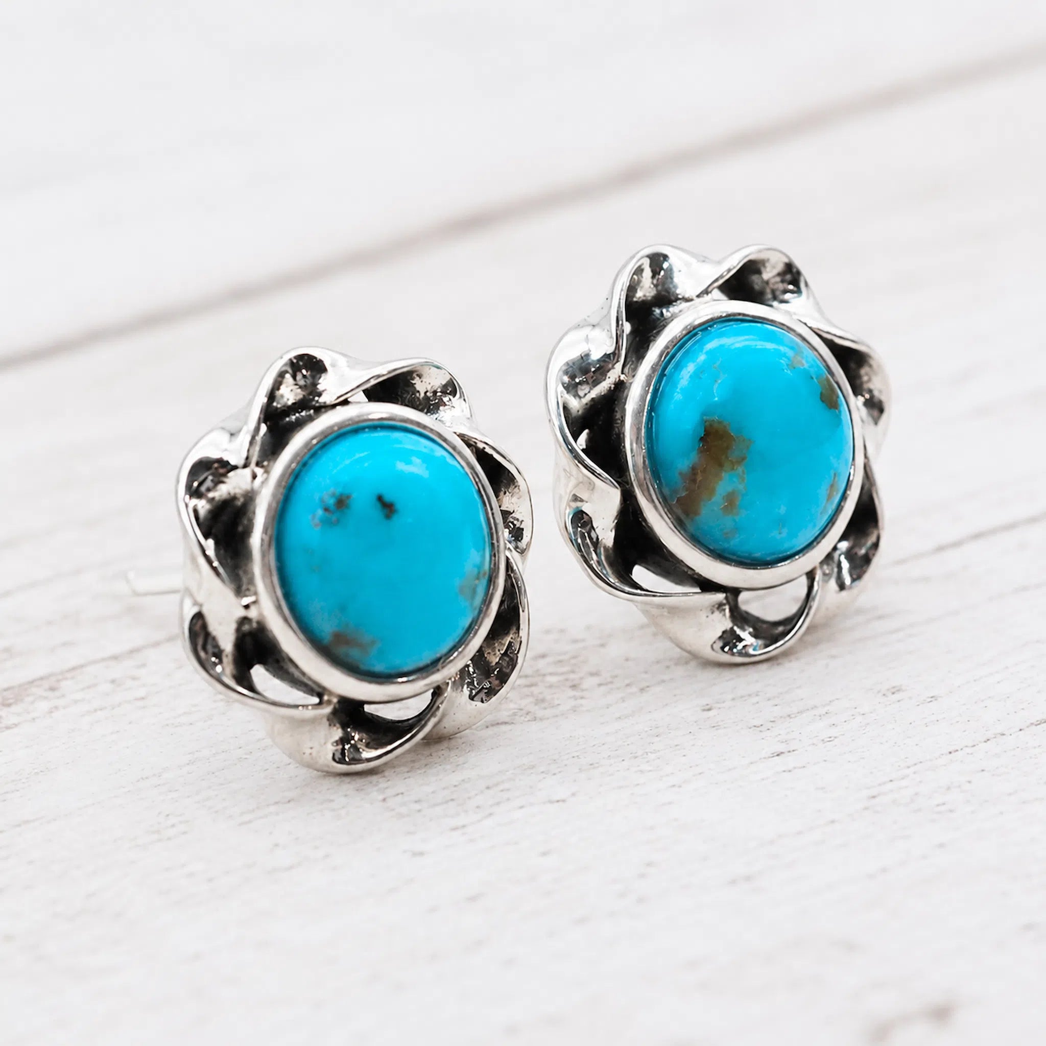 silver turquoise earrings featuring cabochon bezel-set natural turquoise gemstone studs