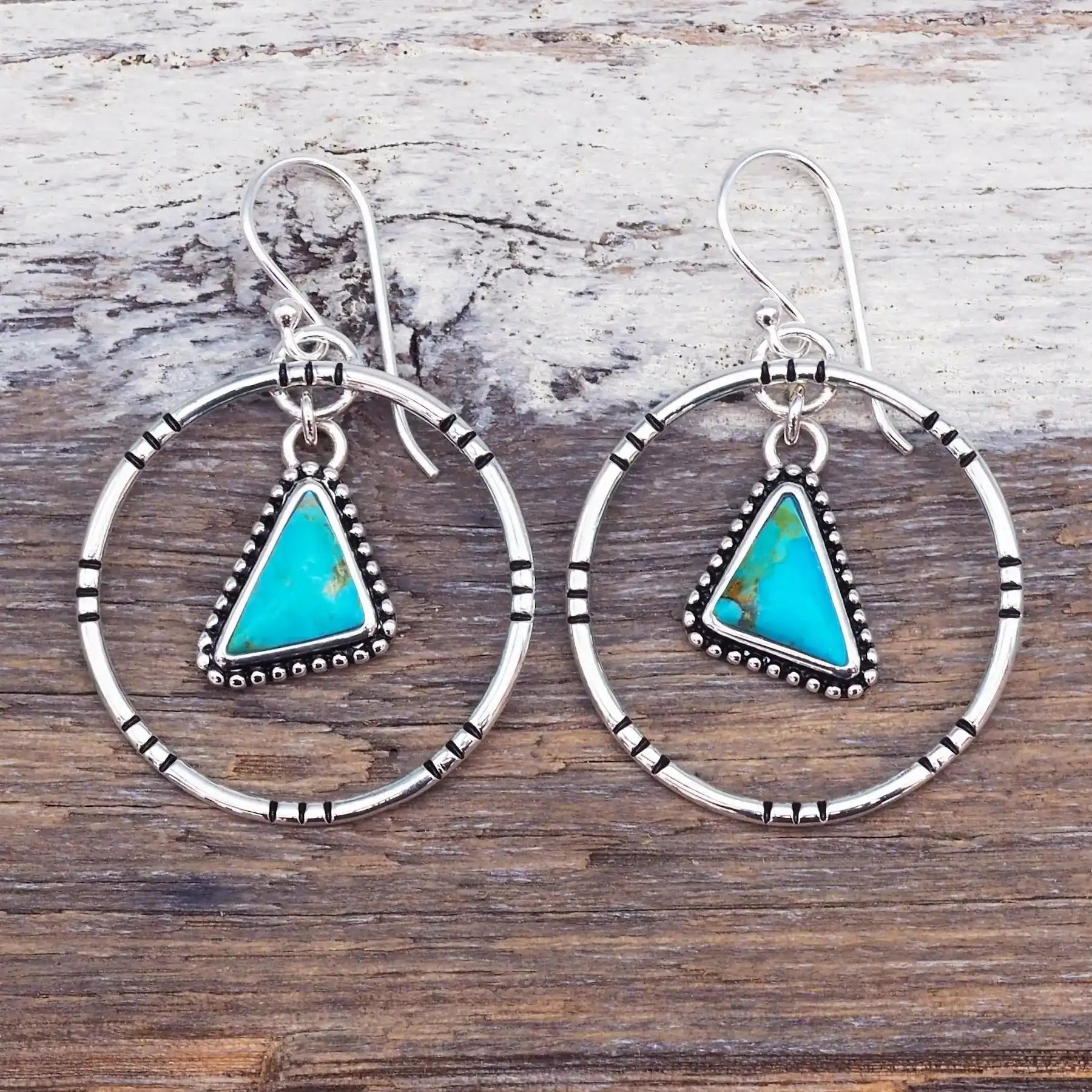 sterling silver Tribal Turquoise Earrings on a wood surface